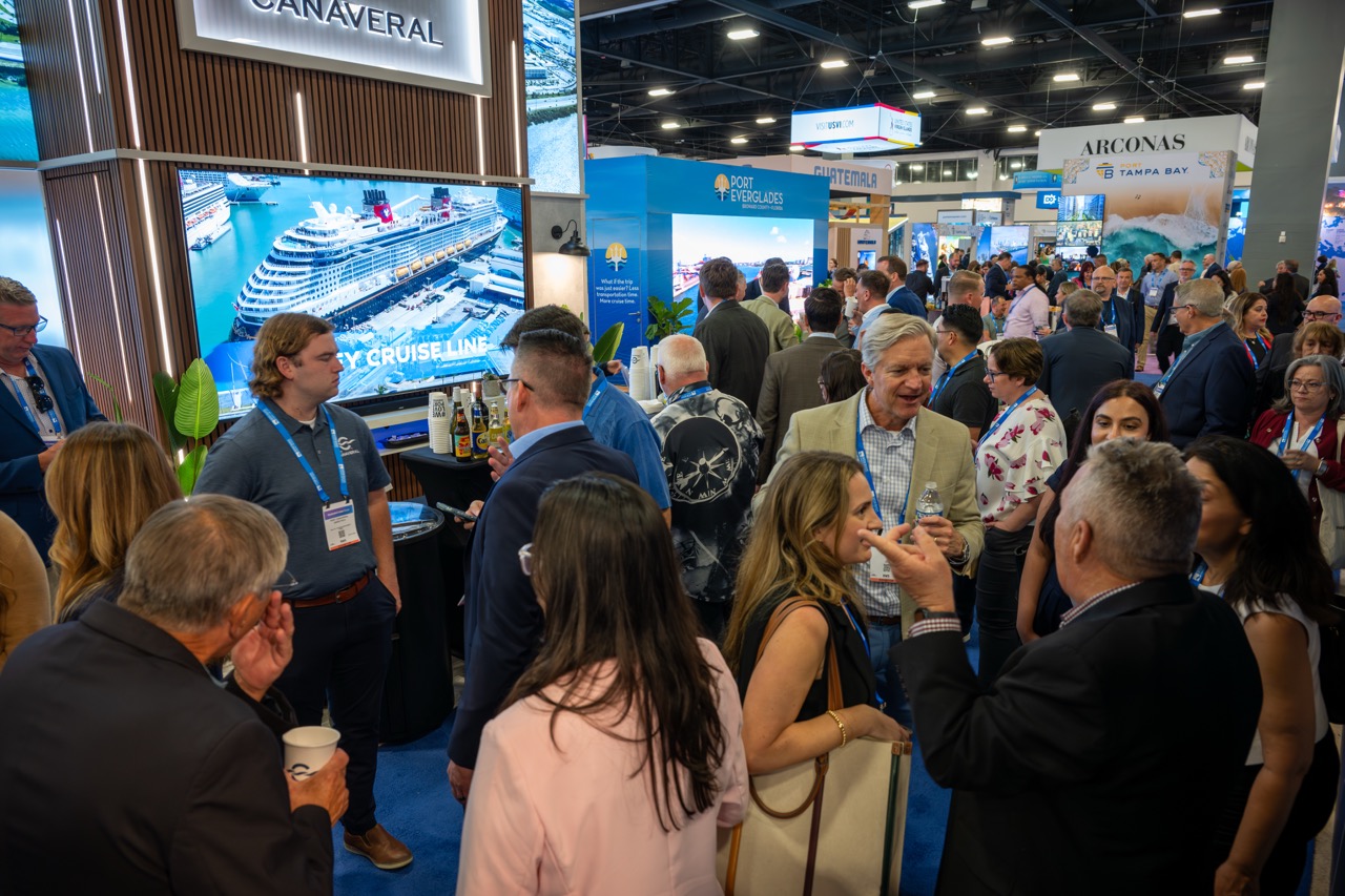 Port Canaveral's 2026 Seatrade booth with professionals networking.