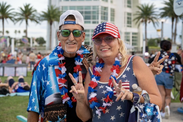 AcoupleinredwhiteandblueposeforaphototogetherataPortCanaveralspecialevent